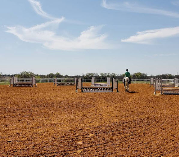 Photo of the outdoor arena with jumps